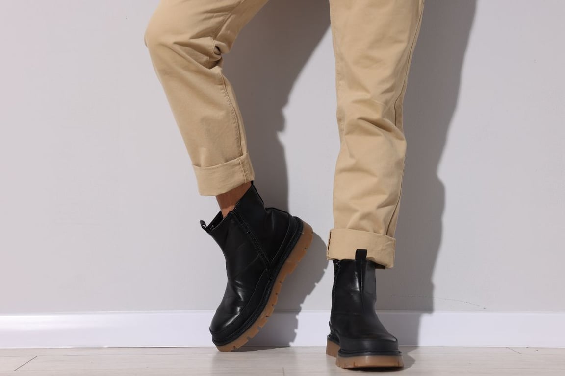 chelsea boots being worn with wide leg pants