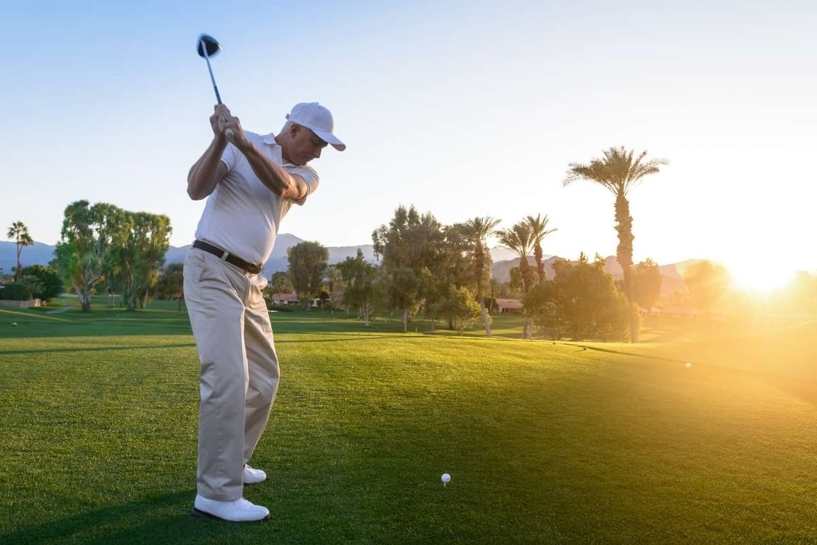 a man swinging a golf club