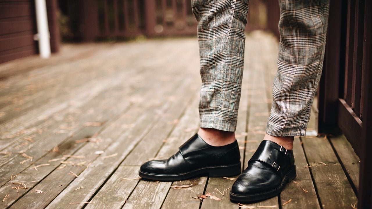 a man wearing a monk strap shoe