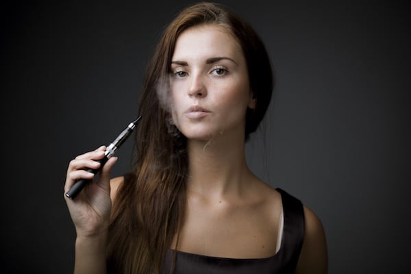 woman smoking vape pen