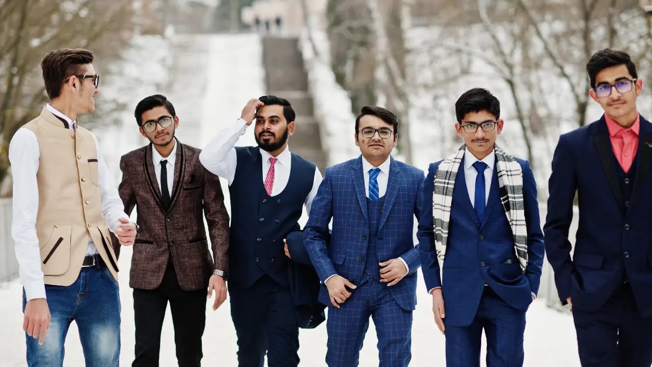 the groom and groomsmen in a winter wedding