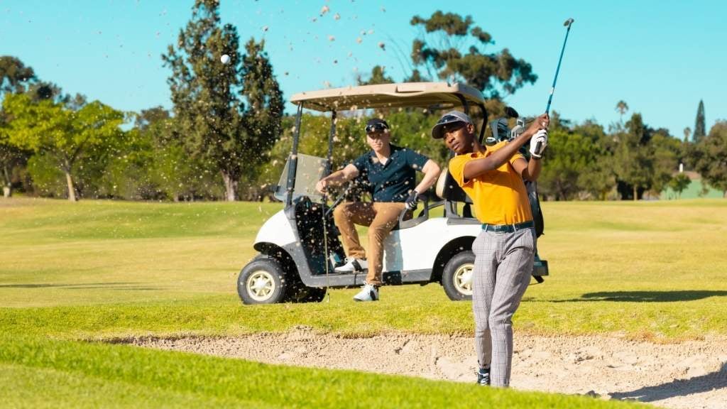 a person playing golf on a sunny day